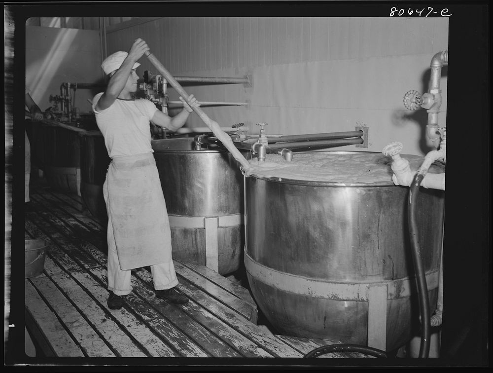 [Untitled photo, possibly related to: Tomato juice is boiled in open vats and then piped to the canning room. Phillips…