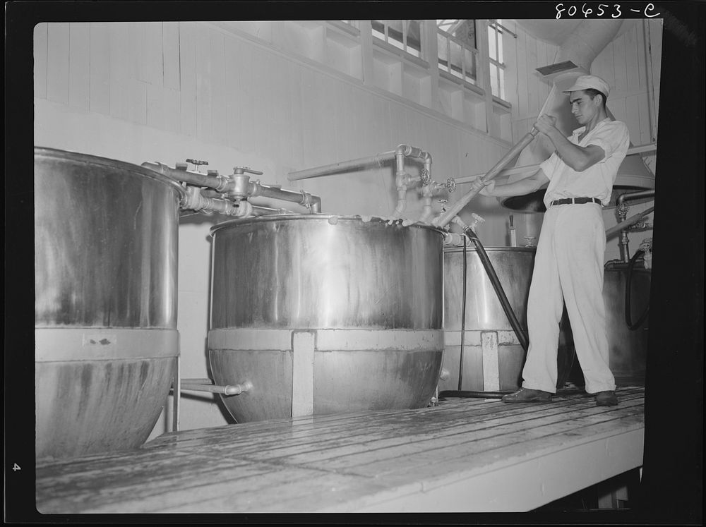 Tomato juice is boiled in open vats and then piped to the canning room. Phillips Packing Company, Cambridge, Maryland.…