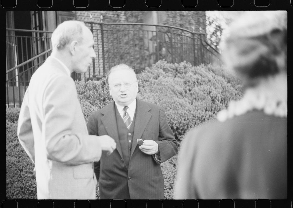 Washington, D.C. Lord Halifax, British ambassador, chatting with Maxim Litvinoff, Russian ambassador, at a garden party at…
