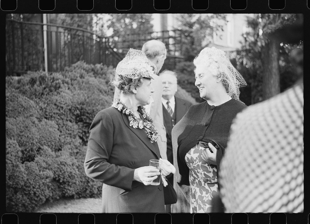 Washington, D.C. Mrs. Henry Morgenthau, wife of the Secretary of the Treasury, chatting with Mrs. Maxim Litvinoff at a…