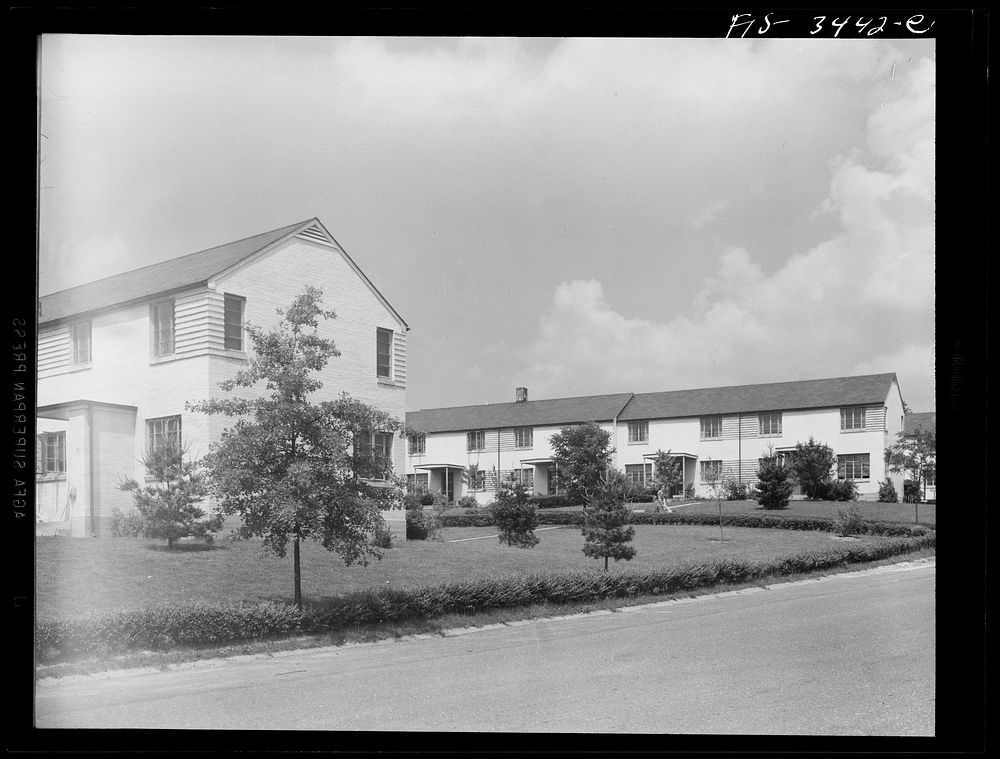 [Untitled photo, possibly related to: Greenbelt, Maryland. Federal housing project. Two rows of gable-roofed houses on Ridge…