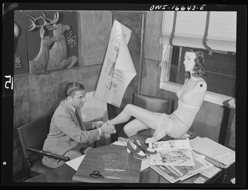 Detroit, Michigan. Head of the art department with new model at the Crowley-Milner department store. Sourced from the…