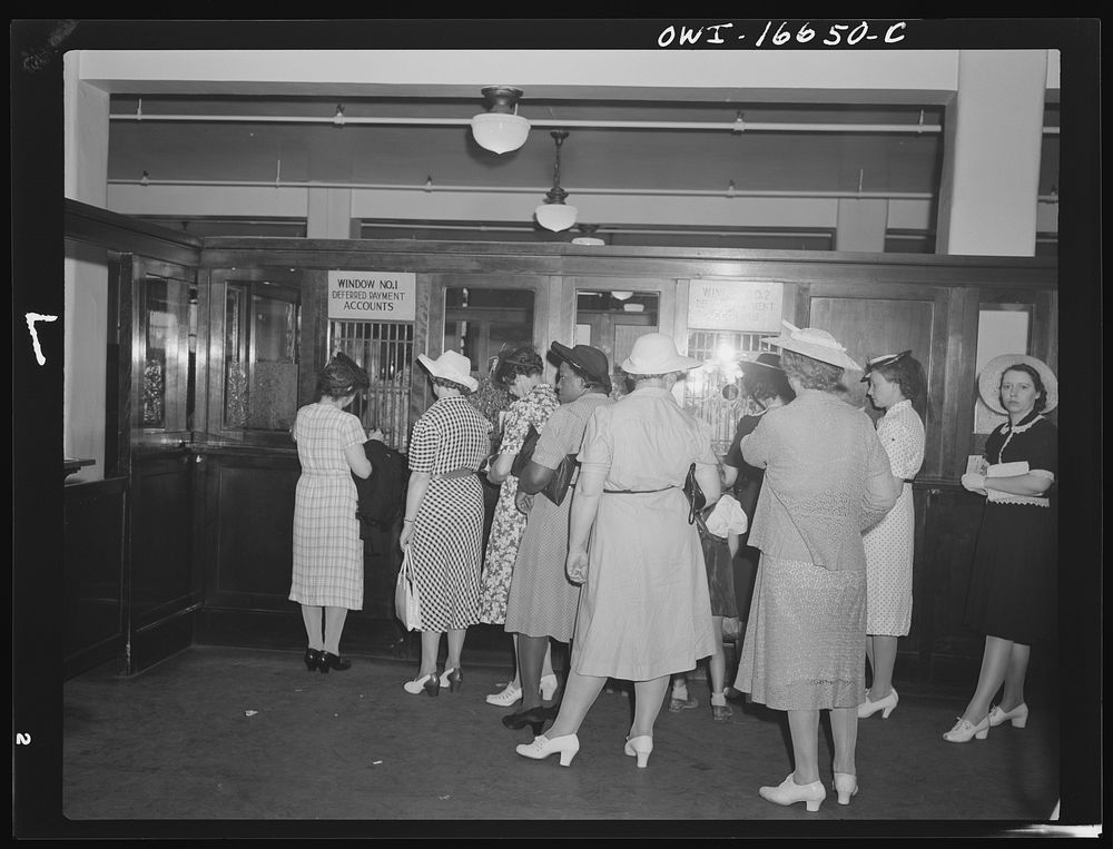 Detroit, Michigan. Women paying bills at the charge account window at the Crowley-Milner department store. Sourced from the…