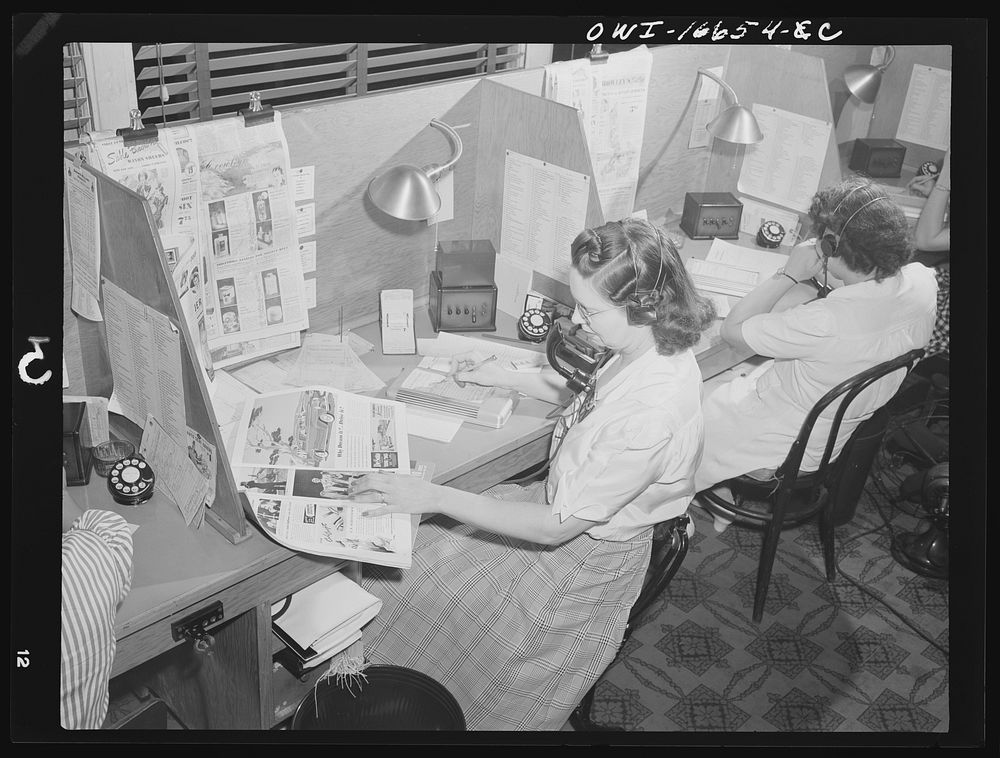 Detroit, Michigan. Operator taking telephone orders at the Crowley-Milner department store. Sourced from the Library of…