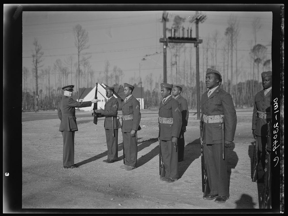 Camp Lejeune, New River, North Carolina. A drill officer with his men on the drill field. Sourced from the Library of…