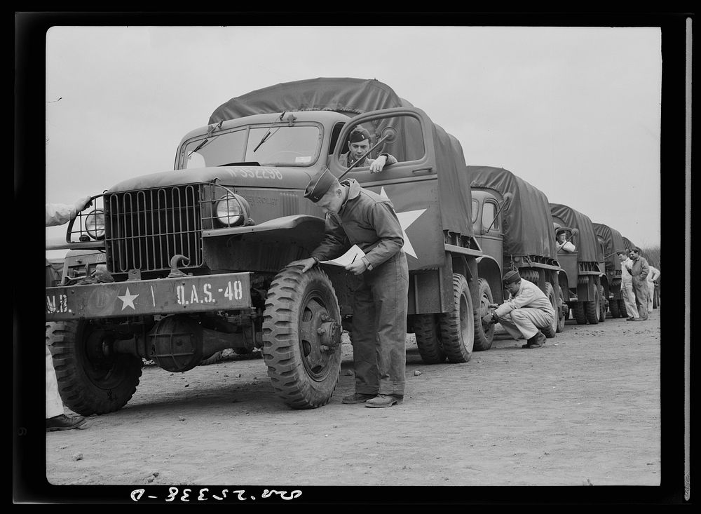 Holabird ordnance depot, Baltimore, Maryland. Before the departure of a truck convoy, drivers must give all vehicles a…