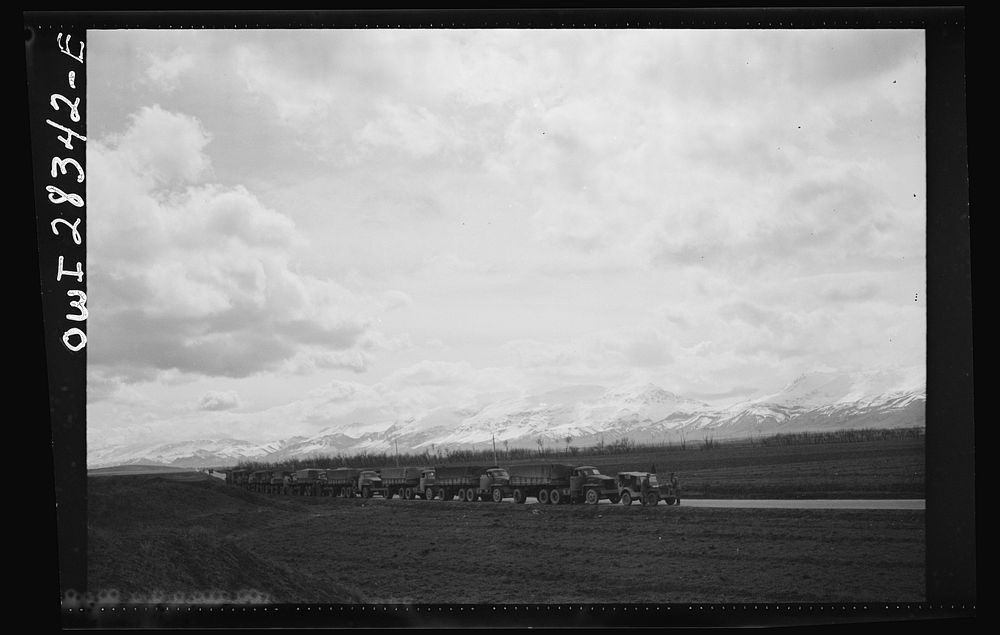 Somewhere in the Persian corridor. A United States Army truck convoy carrying supplies for Russia making a rest stop in a…