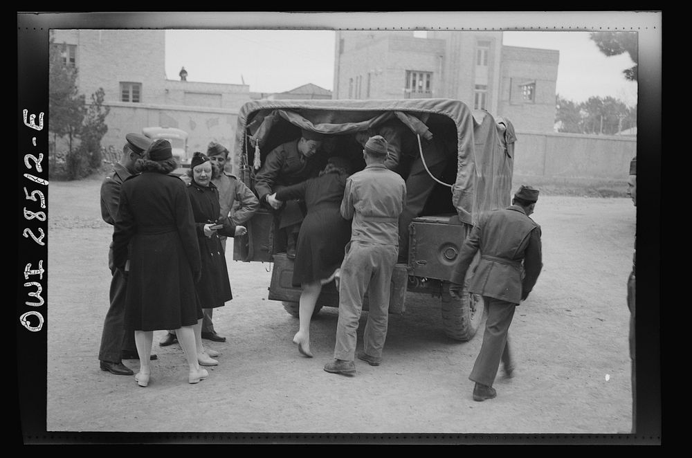 United States Army nurses being helped into the back end of a truck somewhere in Iran. Sourced from the Library of Congress.