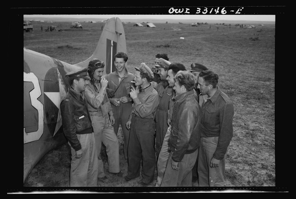 [Untitled photo, possibly related to: Major Glade B. Bilby of Skidmore, Montana talking to members of his flying squadron…