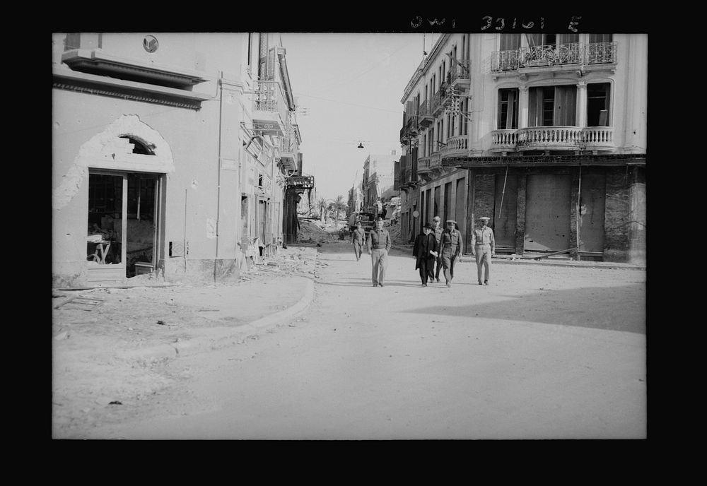 Sousse, Tunisia. Archbishop Spellman walking with American officers through the streets of Sousse. Sourced from the Library…