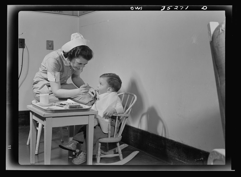 Johns Hopkins Hospital, Baltimore, Maryland. A student nurse feeding a convalescent youngster. Sourced from the Library of…