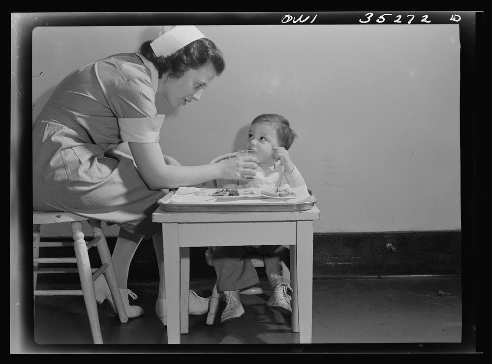 Johns Hopkins Hospital, Baltimore, Maryland. A student nurse feeding a convalescent youngster. Sourced from the Library of…
