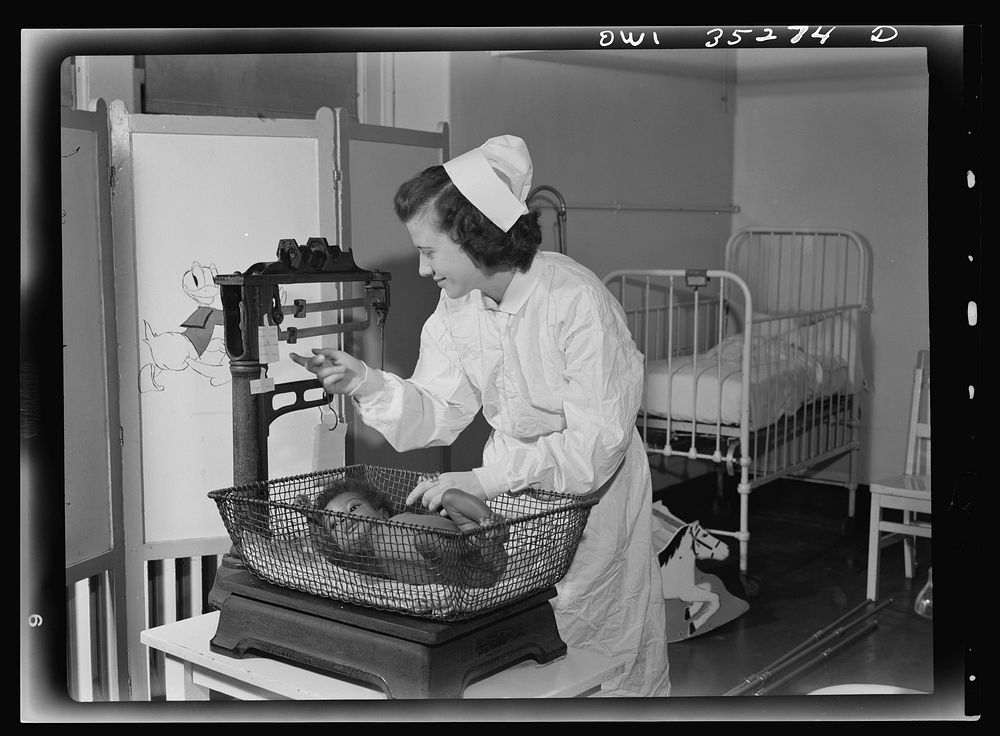 Johns Hopkins Hospital, Baltimore, Maryland. Student nurse at work in the pediatrics ward. Sourced from the Library of…
