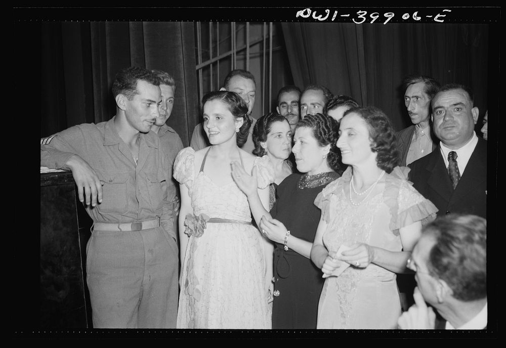 Palermo, Sicily. Allied soldiers and local girls at concert given by the Palermo symphony orchestra. Sourced from the…