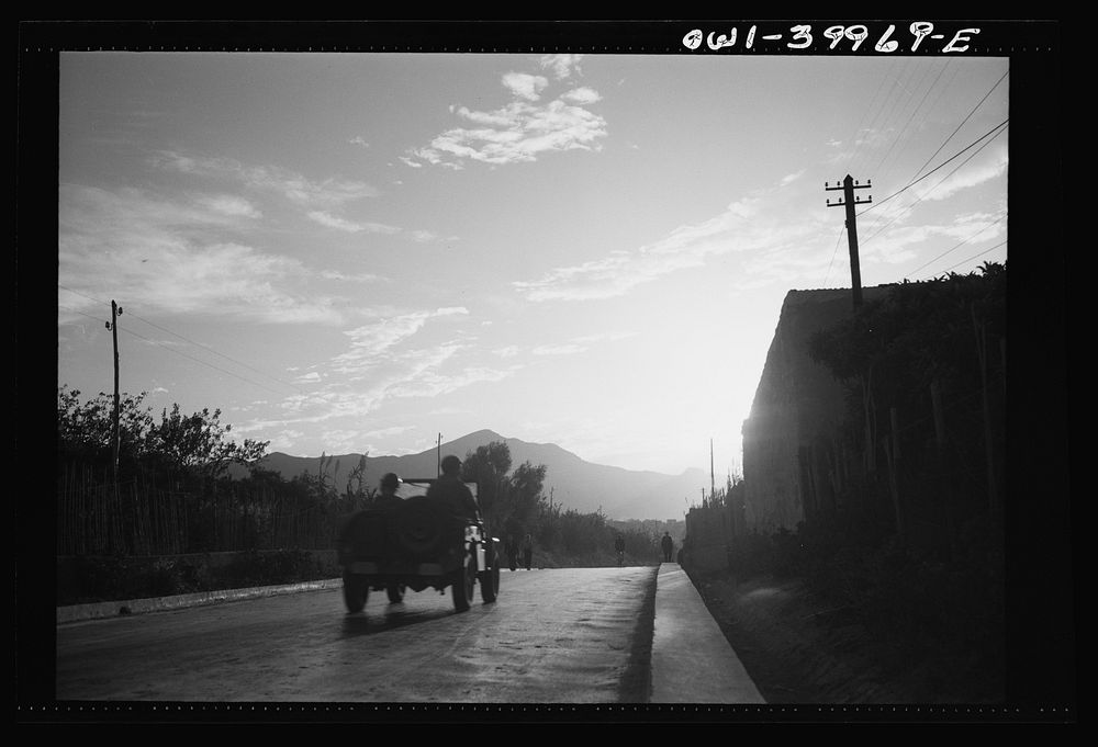 Messina (vicinity), Sicily. Allied soldiers in a jeep driving along a Sicilian road. Sourced from the Library of Congress.