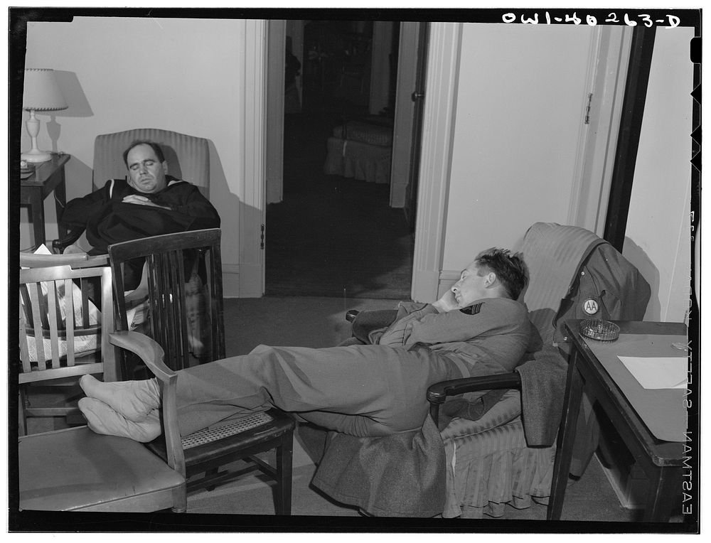 Washington, D.C. Servicemen who must wait several hours between trains sleeping in one of the lounges at the United Nations…