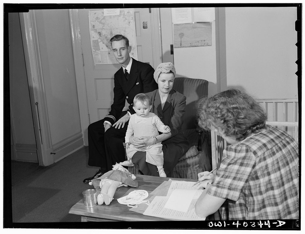 [Untitled photo, possibly related to: Washington, D.C. A naval officer and his wife leaving instructions for the care of…