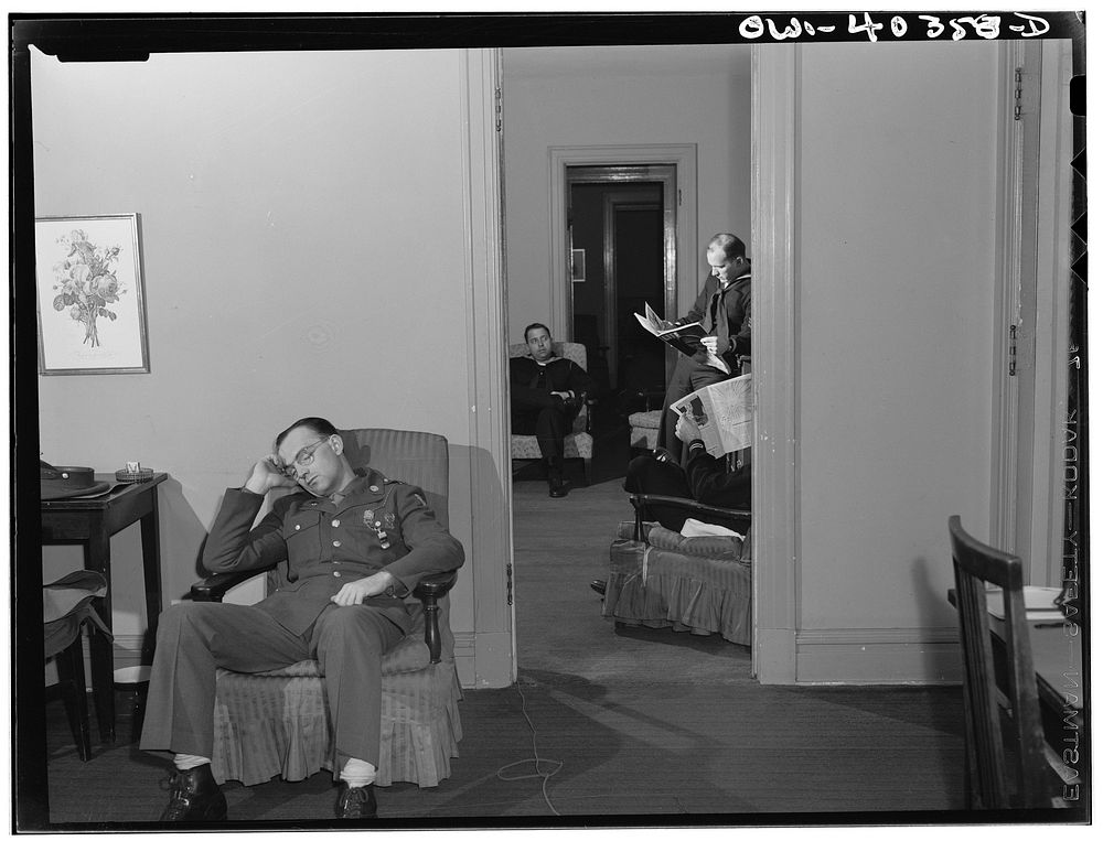 Washington, D.C. Servicemen who must wait several hours between trains sleeping in one of the lounges at the United Nations…