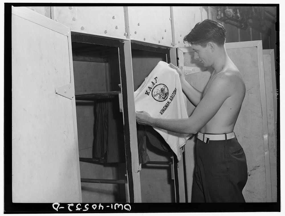Washington, D.C. A soldier in the laundry at the United Nations service center taking his shirt out of the electric dryer…