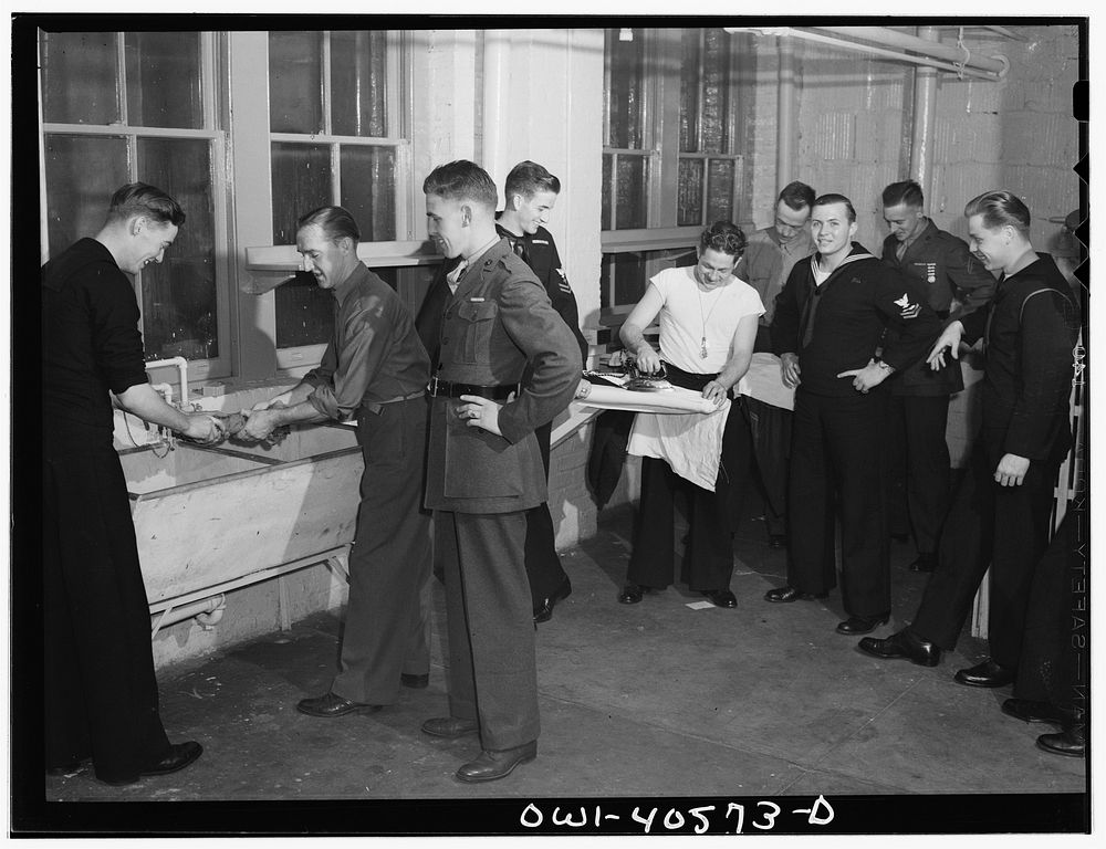 Washington, D.C. Servicemen using and inspecting the laundry facilities at the United Nations service center. Sourced from…