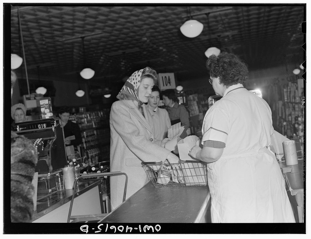 Washington, D.C. Lynn Massman, wife of a second class petty officer who is studying in Washington, shopping for groceries.…