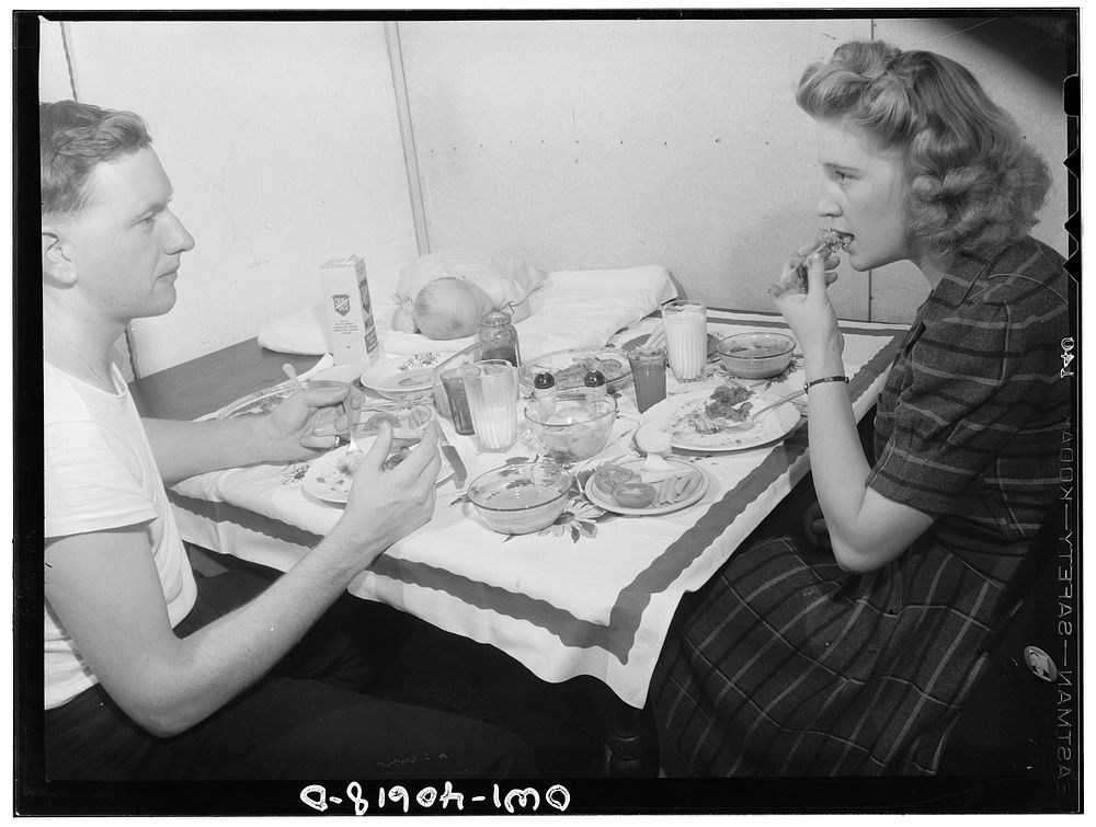 Washington, D.C. Hugh Massman,  a second class petty officer who is studying in Washington, and his wife eating dinner.…