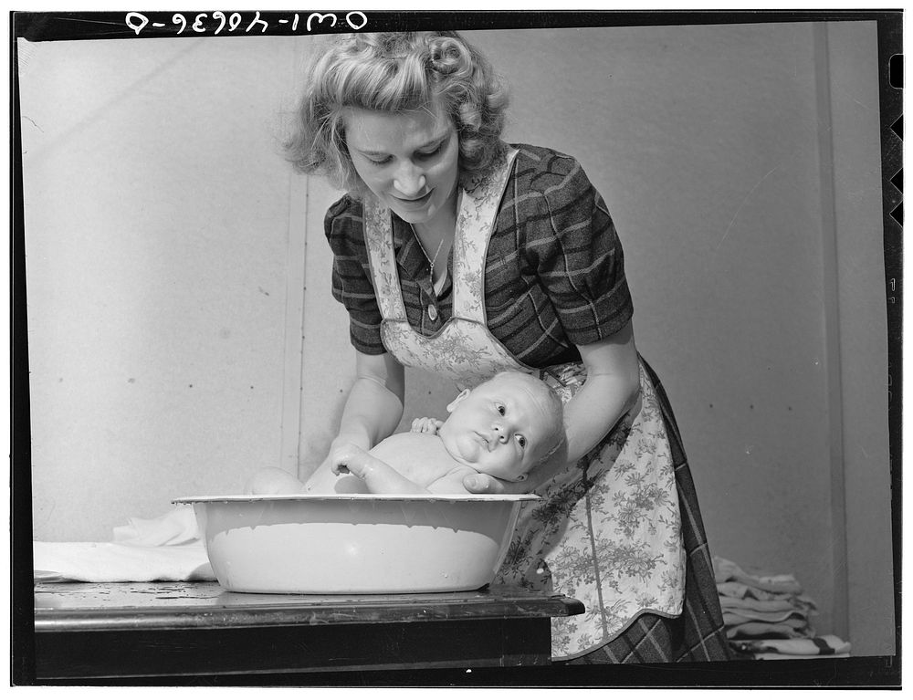 Washington, D.C. Lynn Massman, wife of a second class petty officer studying in Washington, D.C. giving eight weeks old Joey…