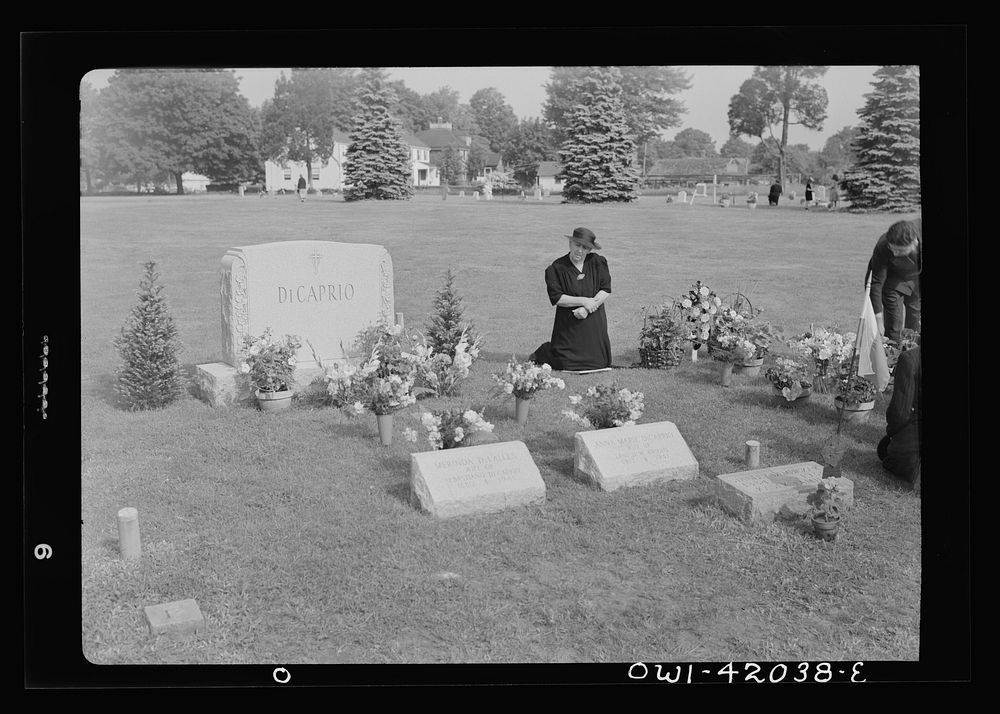 Southington, Connecticut. Woman praying on All Souls' Day in the Saint Thomas cemetery. Sourced from the Library of Congress.