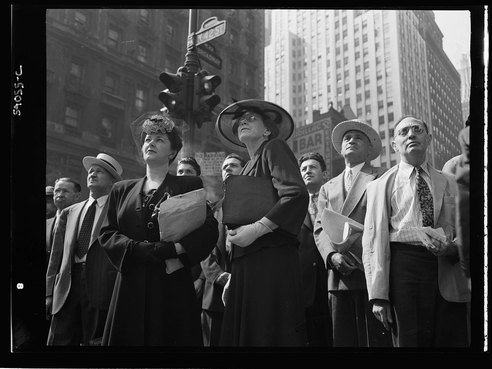 New York, New York. A crowd watching the news line on the Times building at Times Square. Sourced from the Library of…