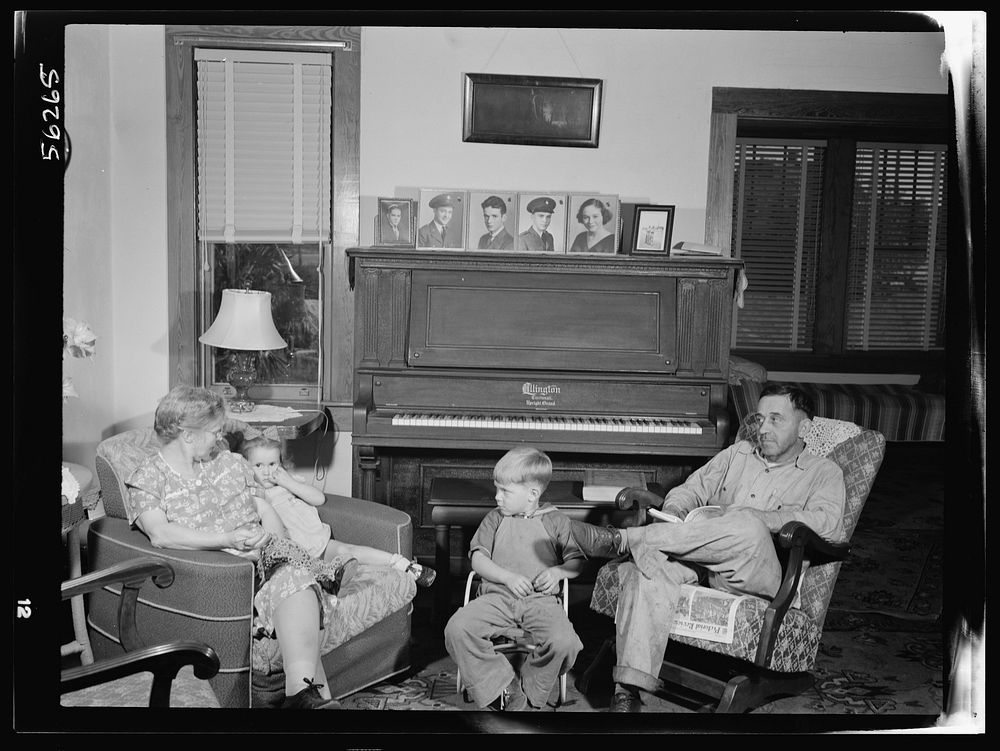 [Untitled photo, possibly related to: De Land pool. La Roe shop. The La Roe family of Eustis, Florida, after a day's work…