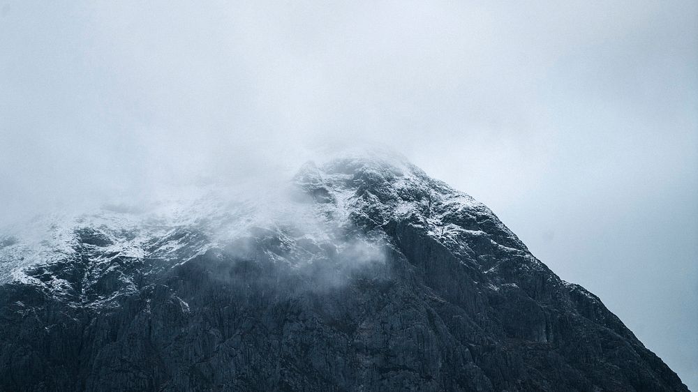 Nature desktop wallpaper background, snowy mountain on a misty day