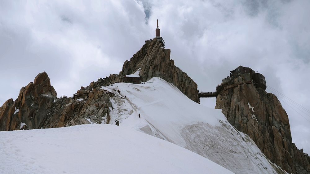 Winter desktop wallpaper background, rocky Aiguille du Midi covered in snow