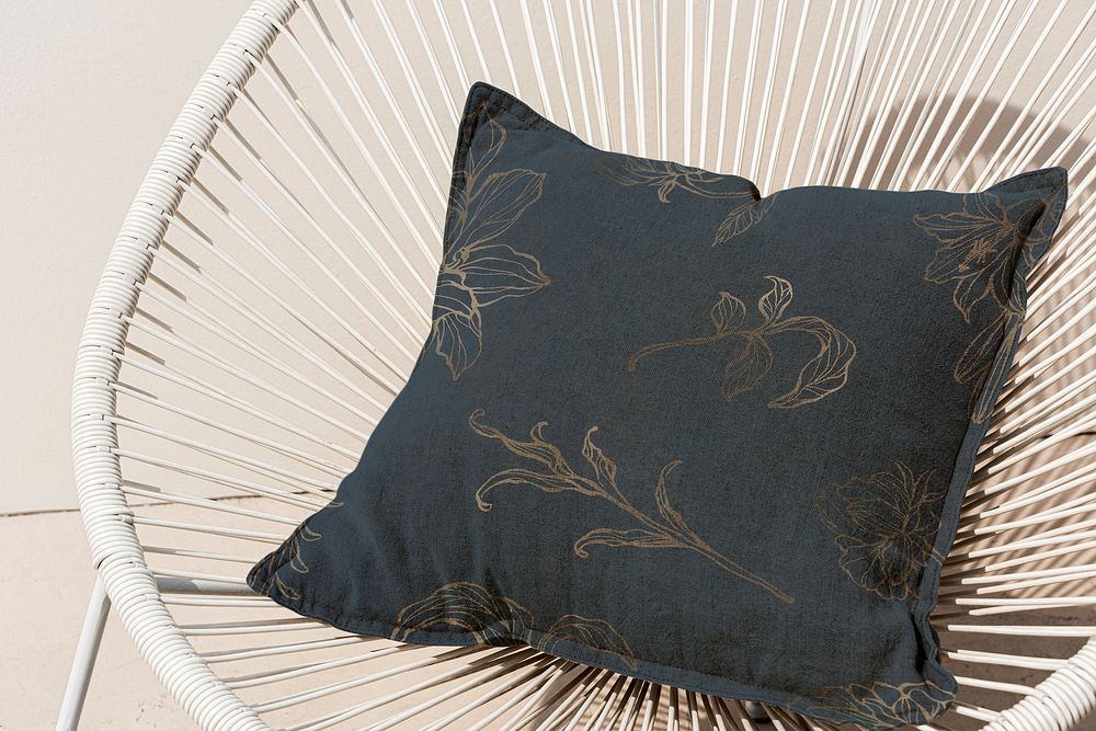 Floral navy printed cushion on a chair minimal interior design