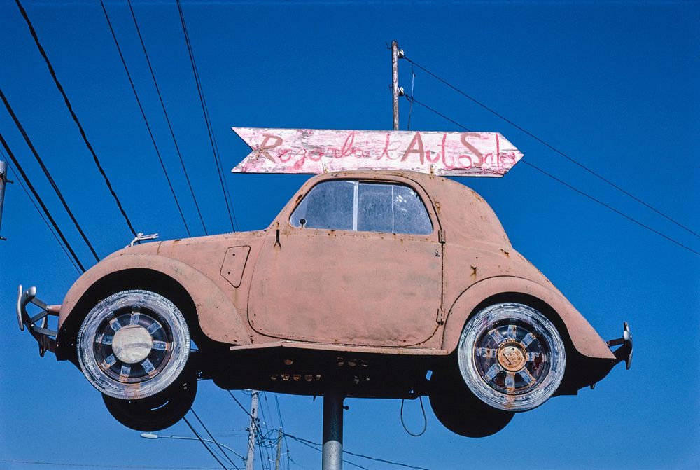 Razorback Auto Sales sign, Route 71, Fayetteville, Arkansas (1984) photography in high resolution by John Margolies.…
