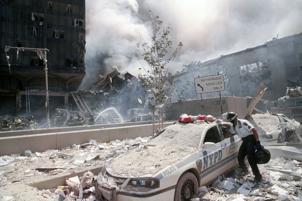 NYPD officer and NYPD car during the aftermath of the September 11 terrorist attack on the World Trade Center, New York…