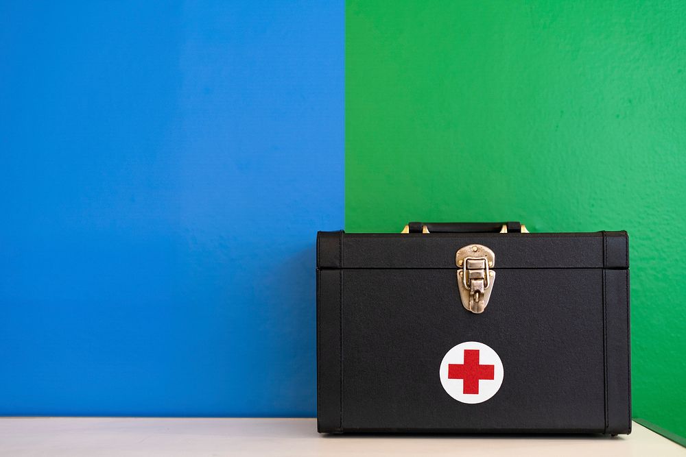 First aid kit on a colorful wall
