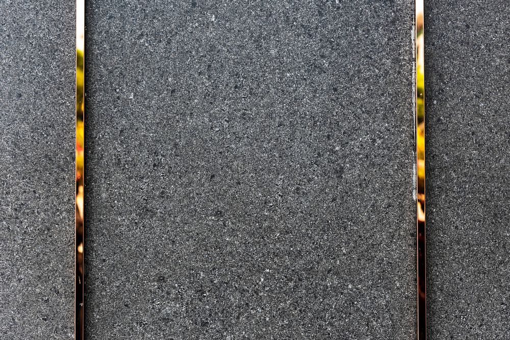 Granite gray textured background with gold frame