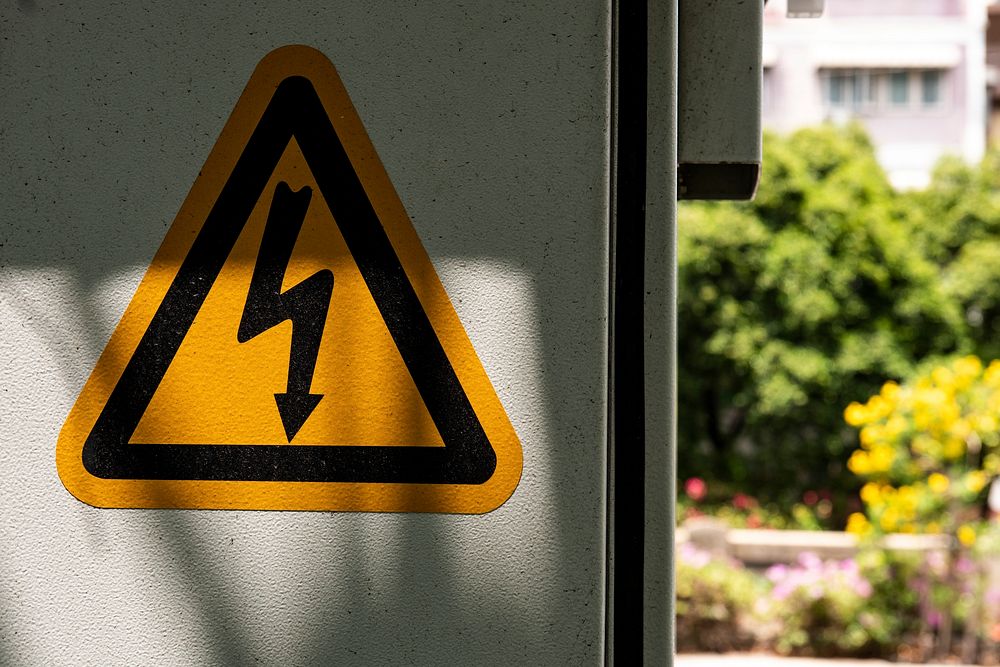 Electrocution warning yellow triangle sign