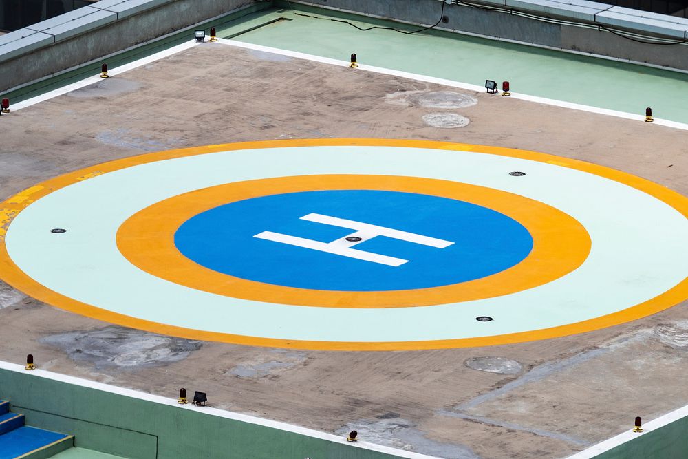 Building's rooftop helipad parking for helicopter