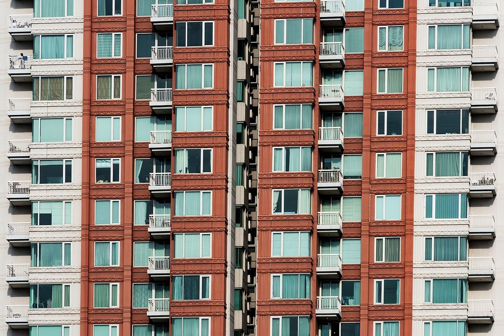 Brown condominium building exterior view closeup