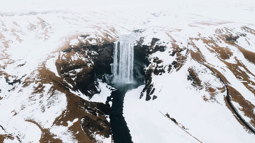 Nature desktop wallpaper background, Skogafoss waterfall in the wintertime, Iceland