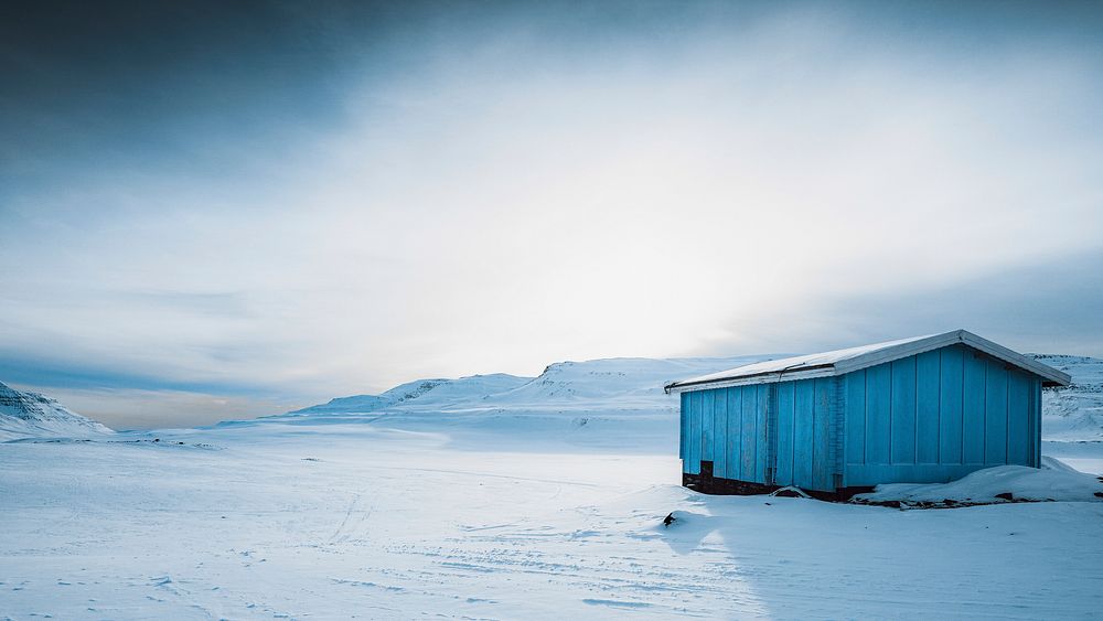 Nature desktop wallpaper background, abandoned wooden cabin in the snowy countryside of Greenland