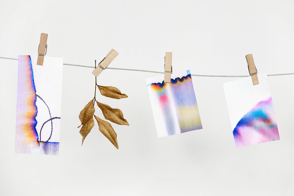 Chromatography colorful papers hanging from a rope with paper clips