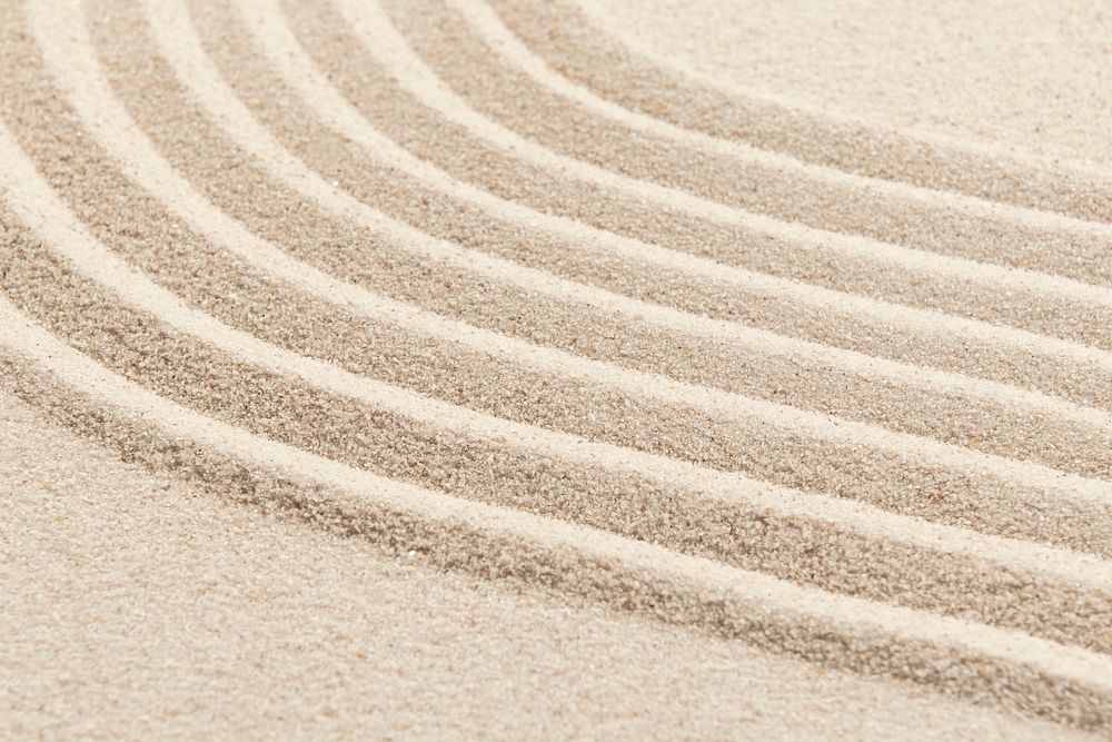 Zen sand wave textured background in mindfulness concept