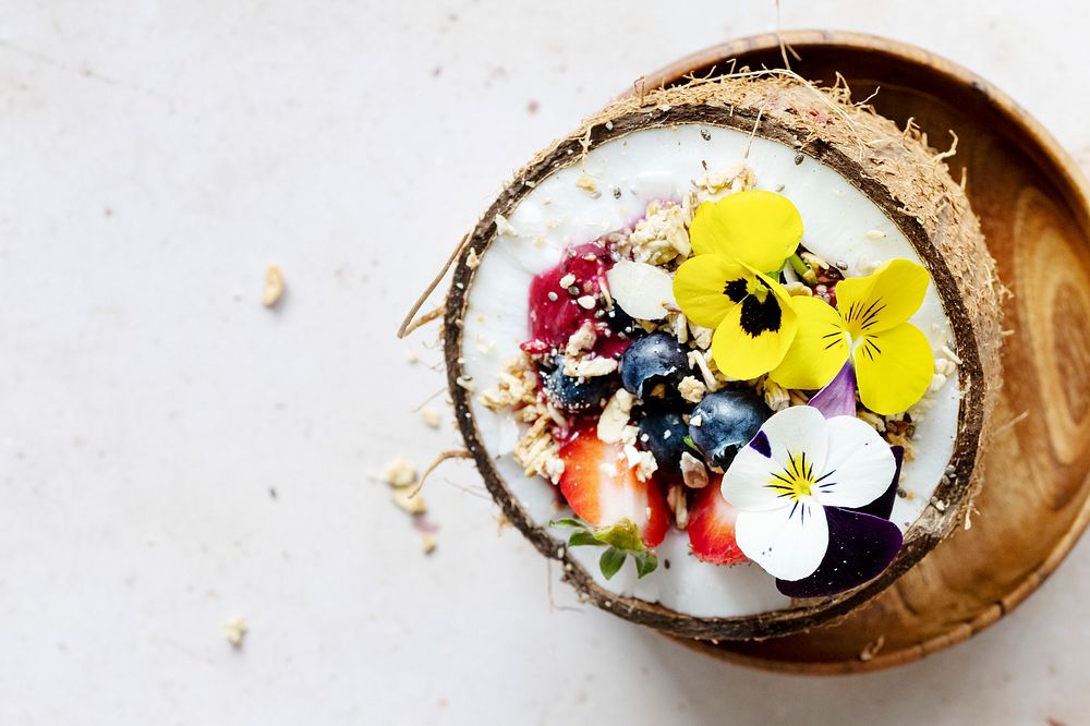 Flat lay fruits and grains in coconut shell tropical vibes 