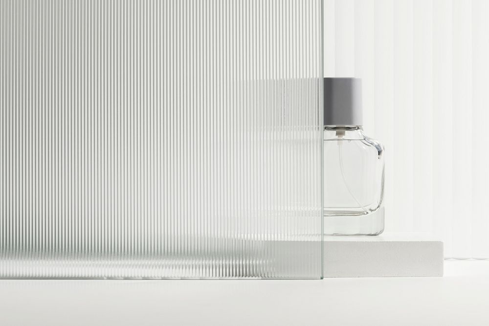 Pattern glass product backdrop with perfume bottle