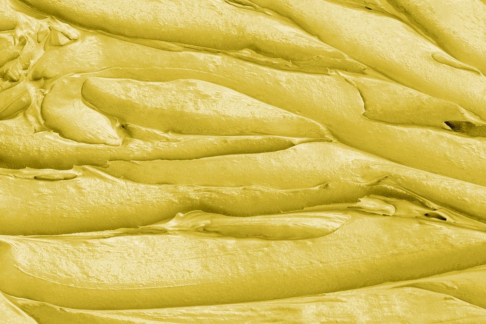 Yellow frosting texture background close-up