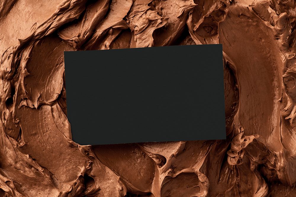 Chocolate frosting texture background with business card