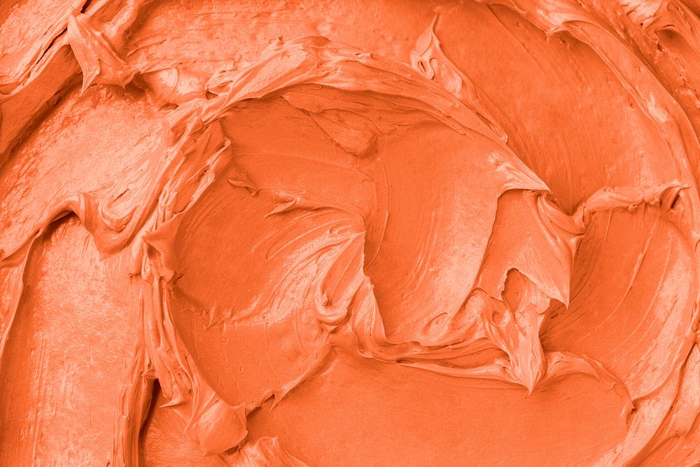 Orange frosting texture background close-up