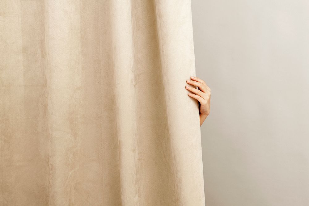 Beige curtain home decor, with female hand